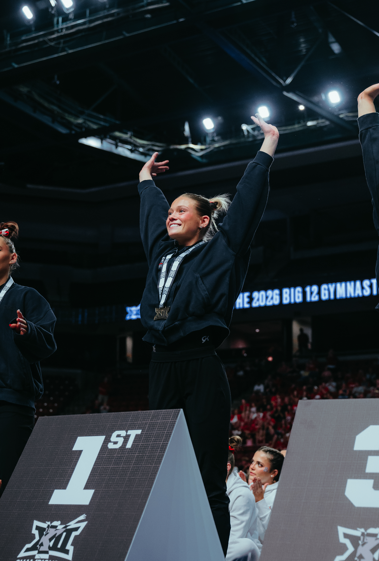 Avery Neff celebrating on podium with first place finish