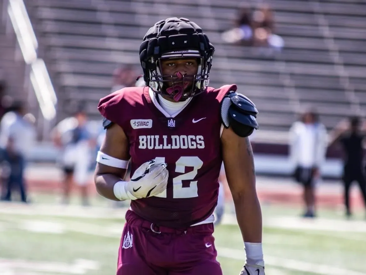 Andre Tibbs Jr walking in Alabama A&M uniform before a game