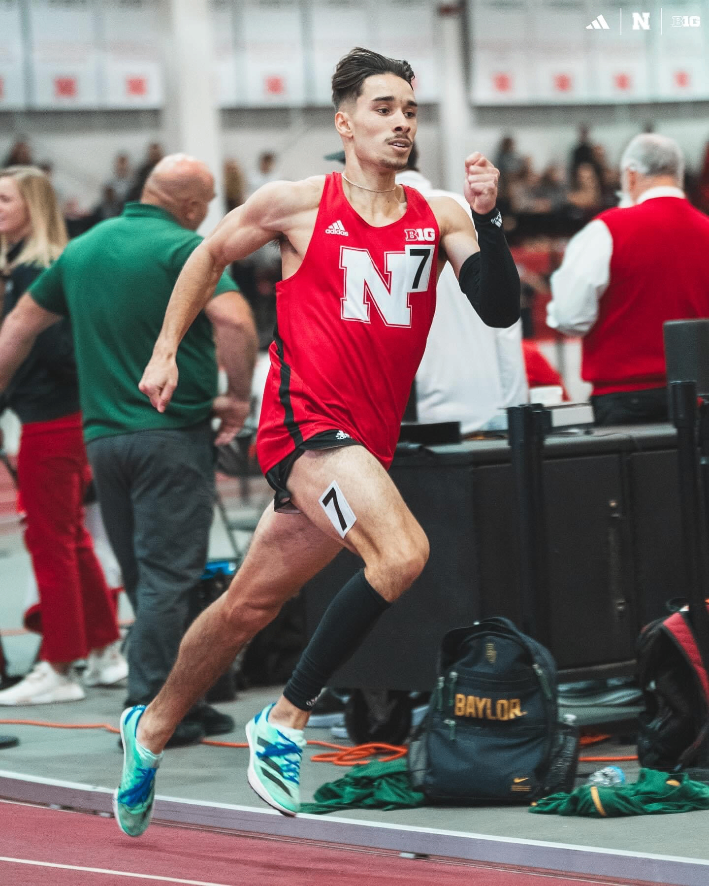 Niko Schultz sprinting indoors for Nebraska