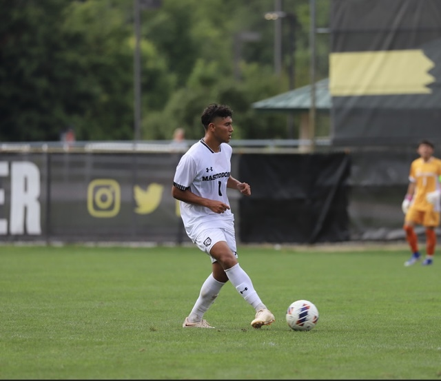 Abraham Arellano carrying the ball in a daytime match