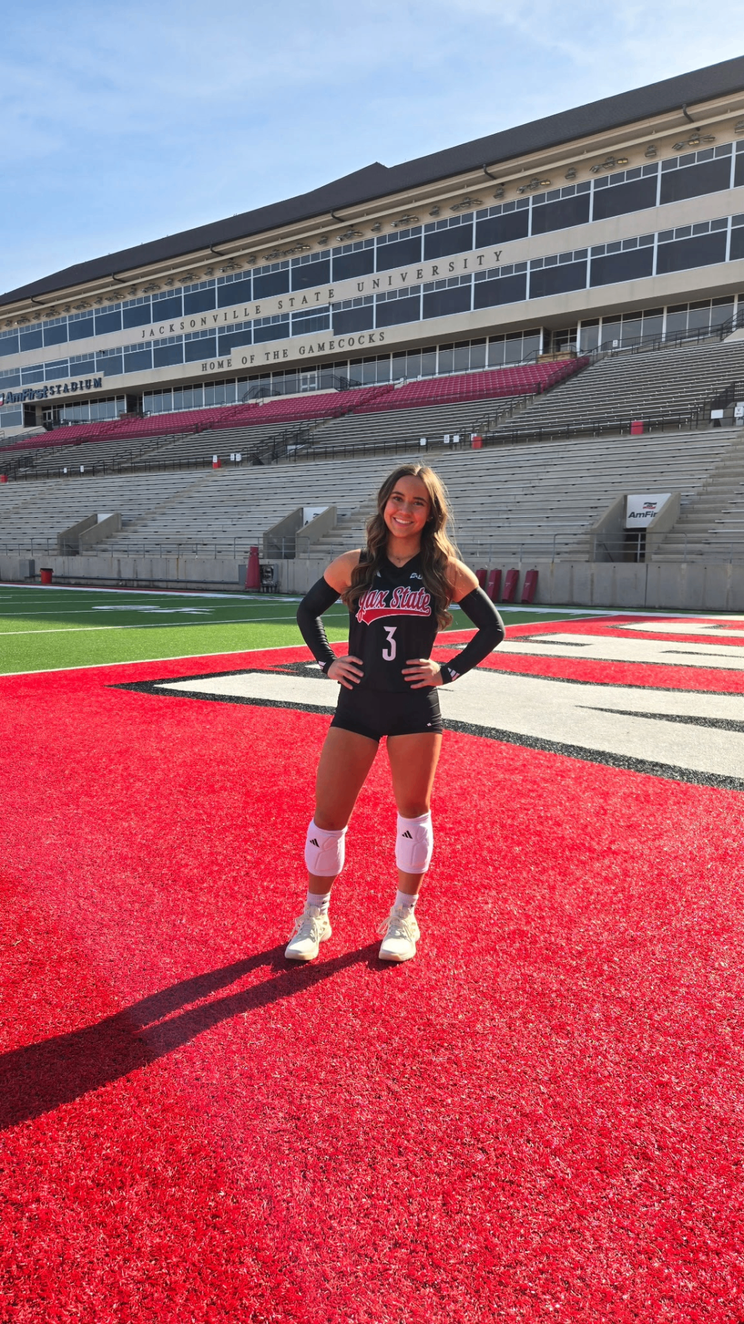 Delaney Moon in Jax State gear on the field at AmFirst Stadium, home of the Gamecocks