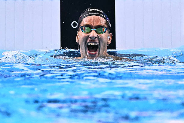 Ahmed Jaouadi shouting in the pool after a race