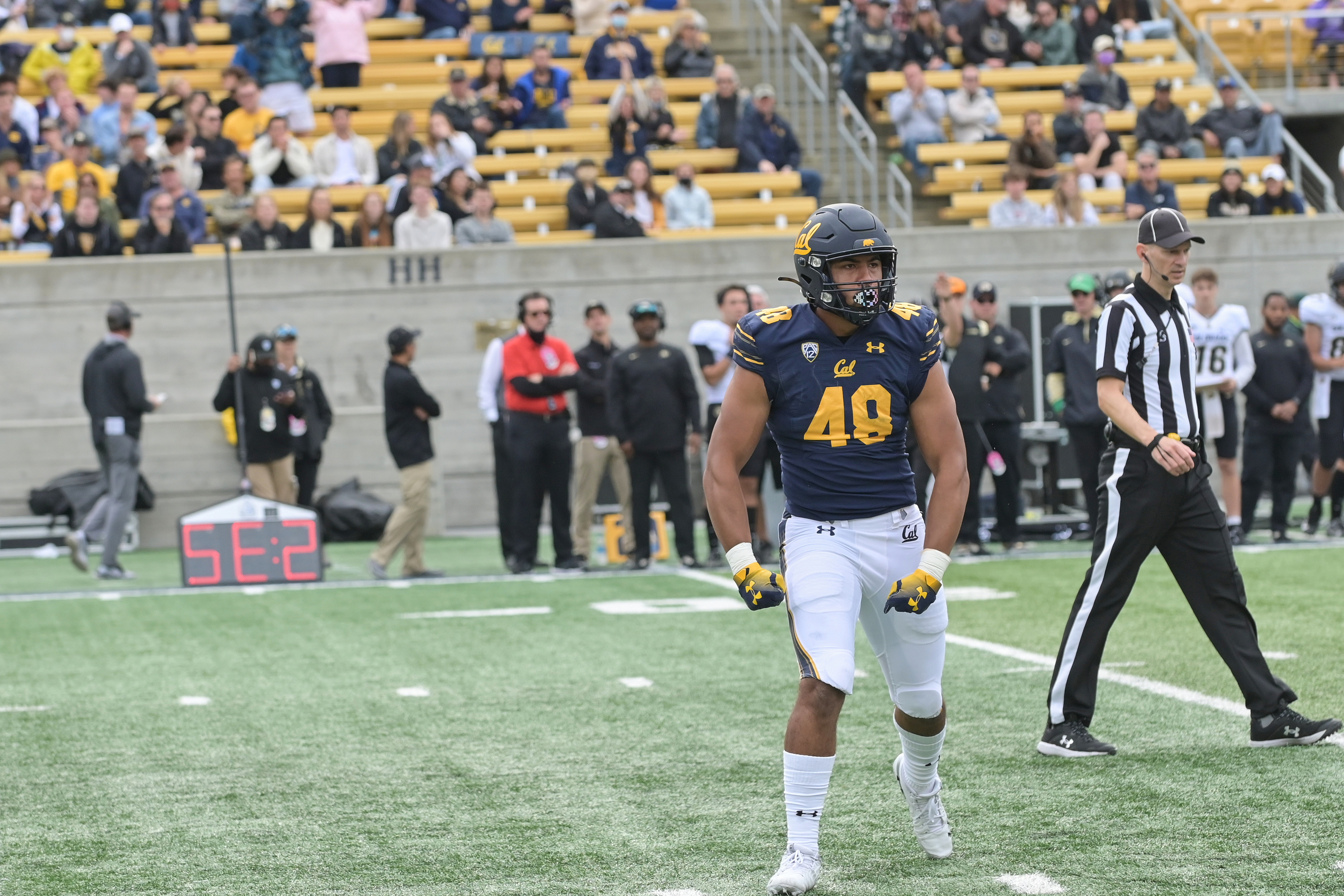 Orin Patu in Cal Golden Bears jersey number 48 walking on the field at Memorial Stadium