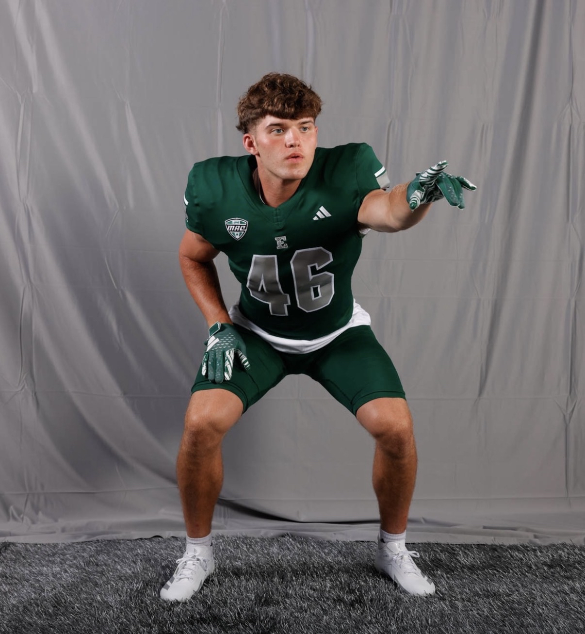 Noah Knigga in an Eastern Michigan jersey in a defensive stance