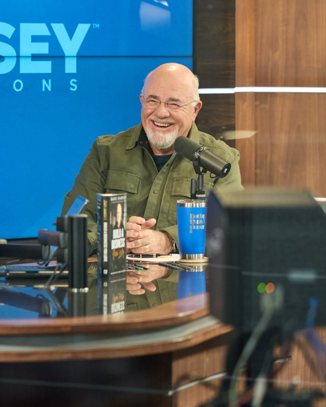 Dave Ramsey laughing in The Ramsey Show studio