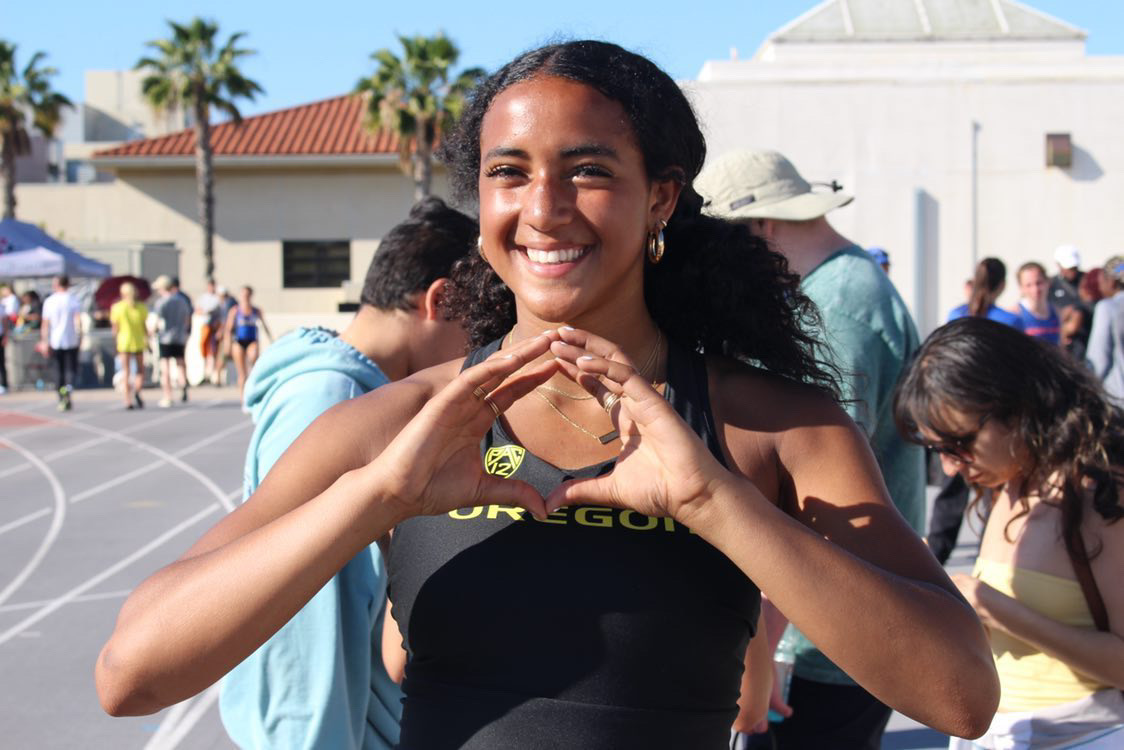 Gianna Bullock smiling on the track after competition