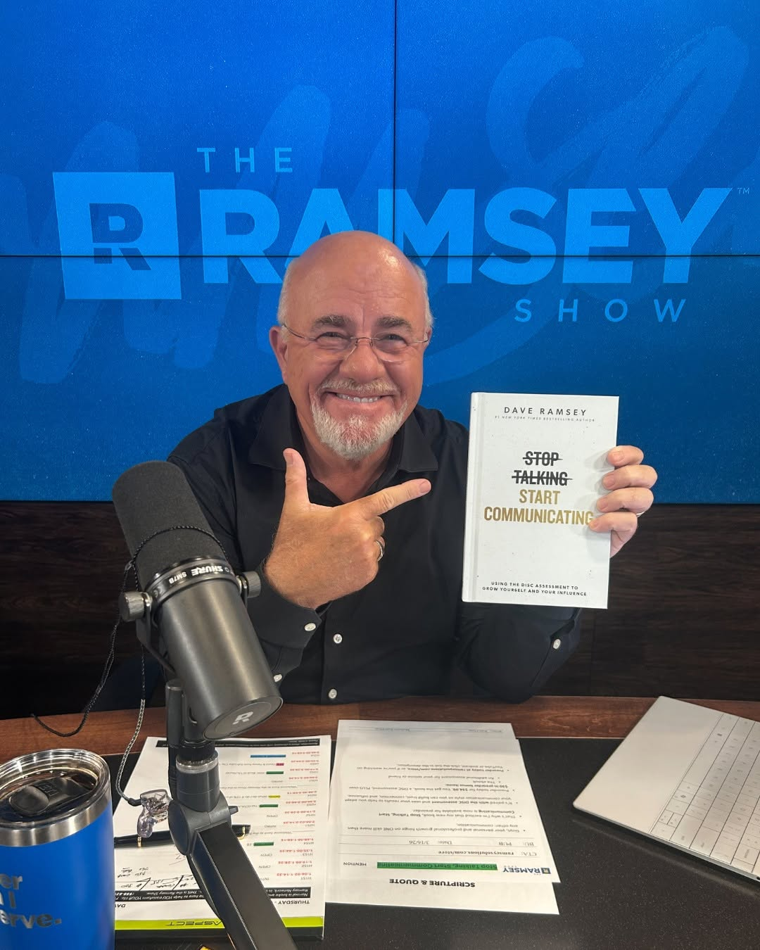 Dave Ramsey holding Stop Talking, Start Communicating in the Ramsey Show studio
