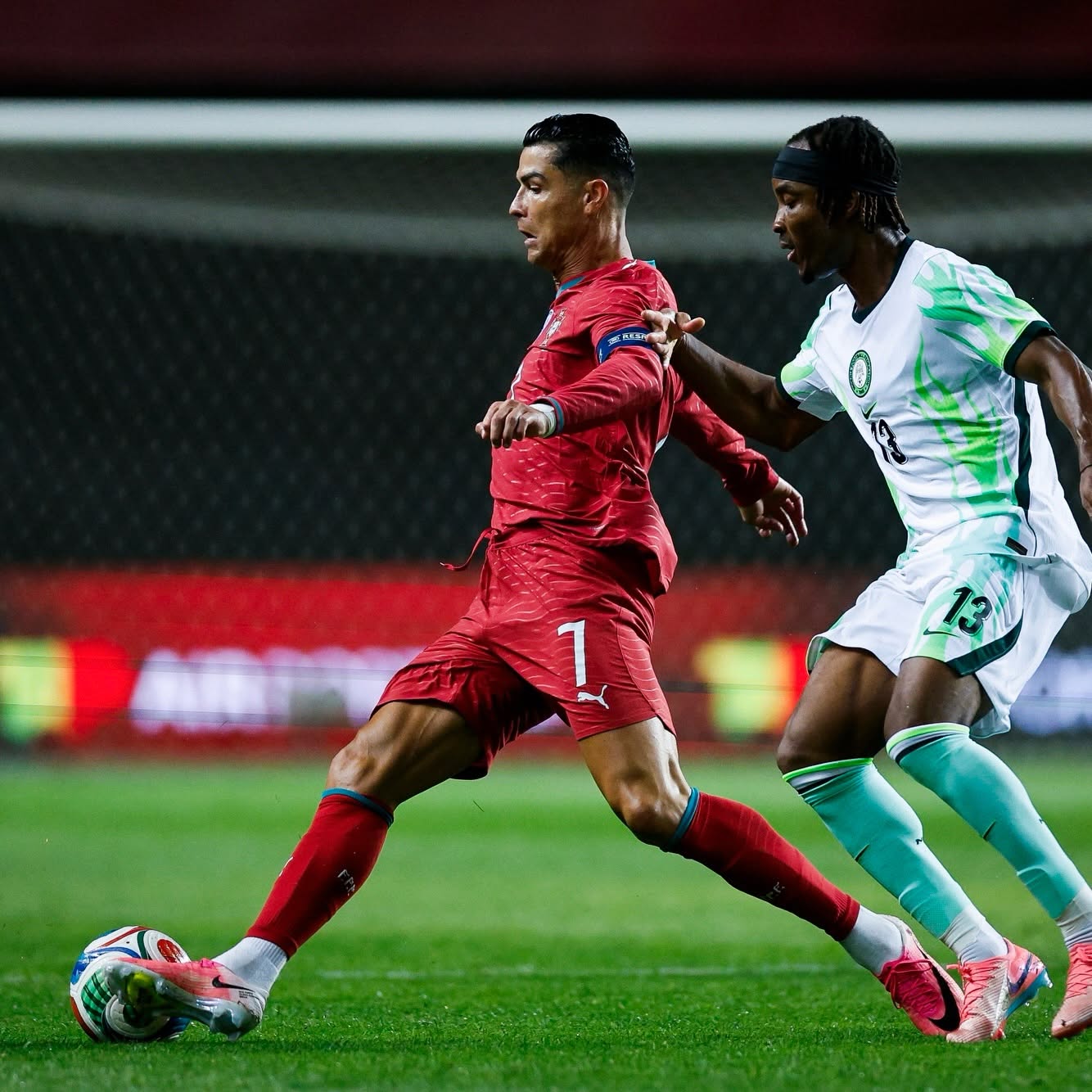 Cristiano Ronaldo in Portugal kit, dramatic lighting