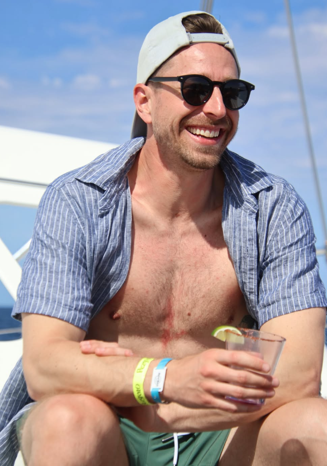 Kyle McIntosh on a sailboat in the sun