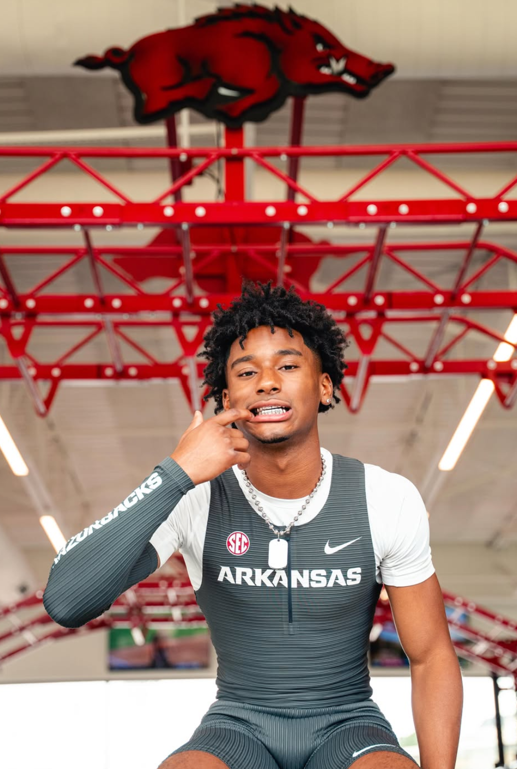 Jaden Wiley in an Arkansas Razorbacks track singlet under the team logo