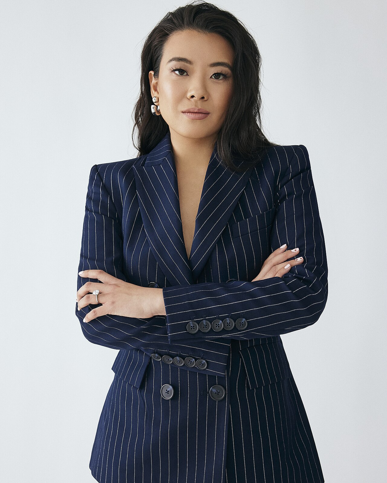 Vivian Tu portrait in a navy pinstripe blazer