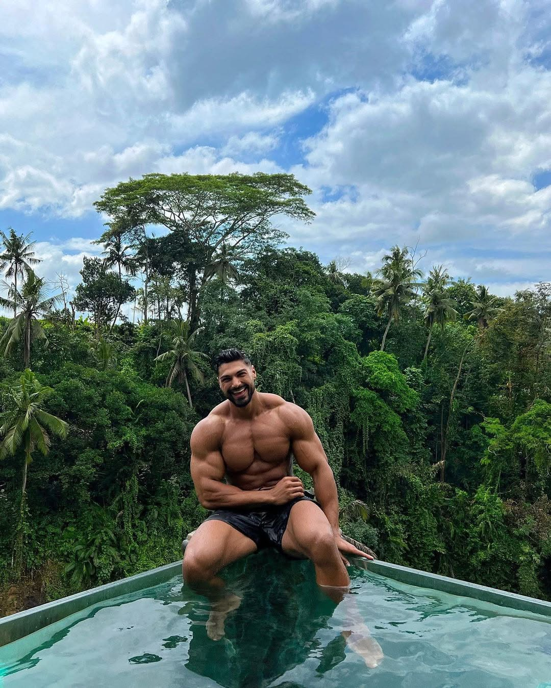Andrei Deiu at an infinity pool in the jungle